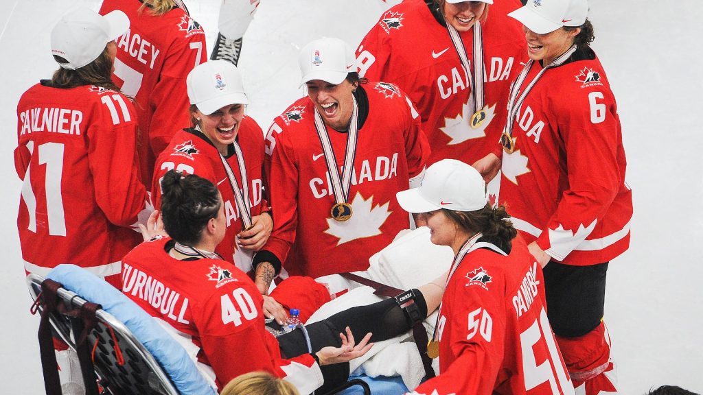 The hockey player was injured during the ceremony and pushed back on a stretcher to hand over the medal