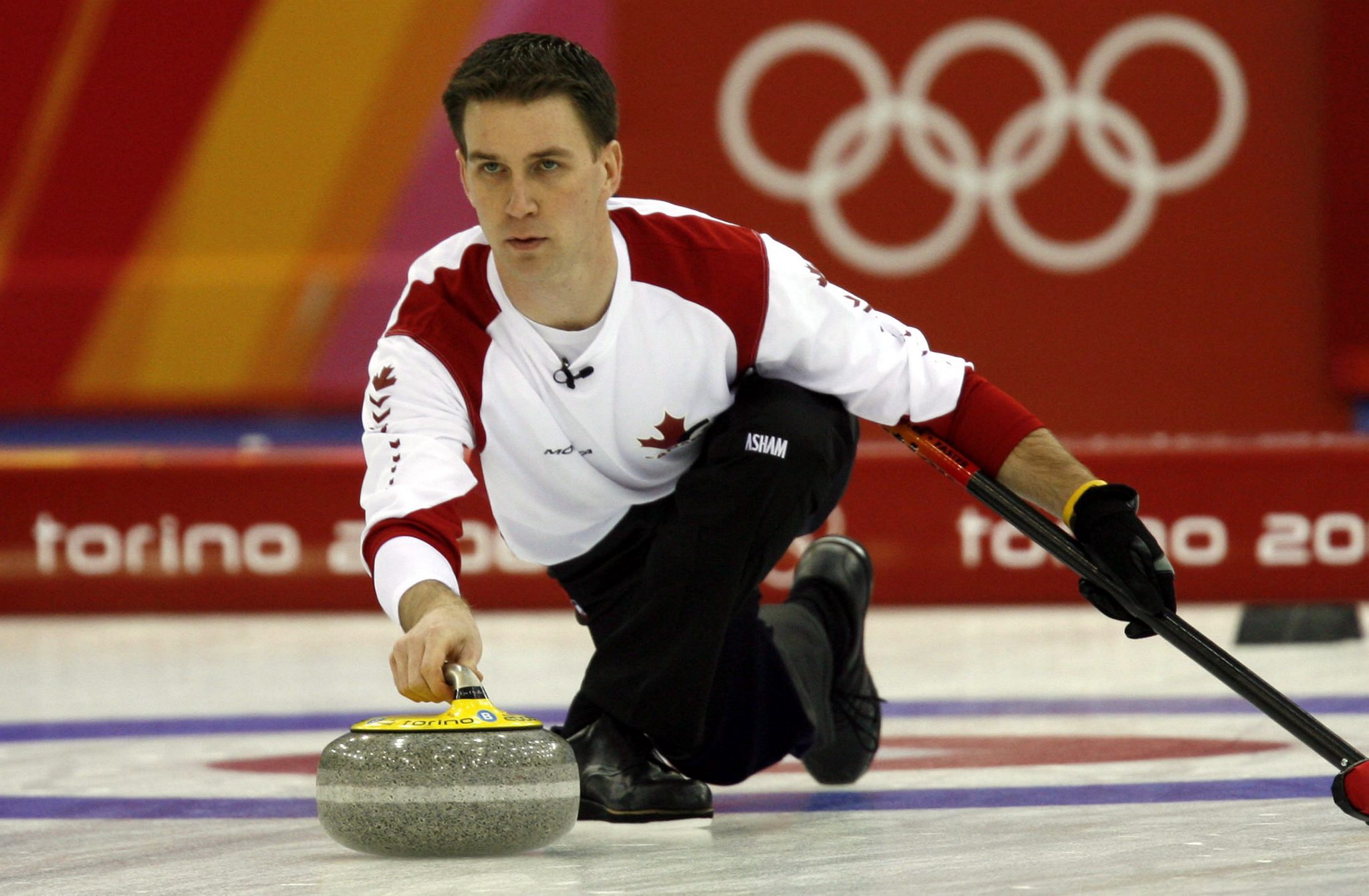 Brad Josh, a Canadian player, throws a stone in the final at the Turin Winter Olympics curling final in Pinerolo on February 24, 2006. Canada won 10-4 and won a gold medal.  Photo: MTI/EPA/Valdrin Xhemaj