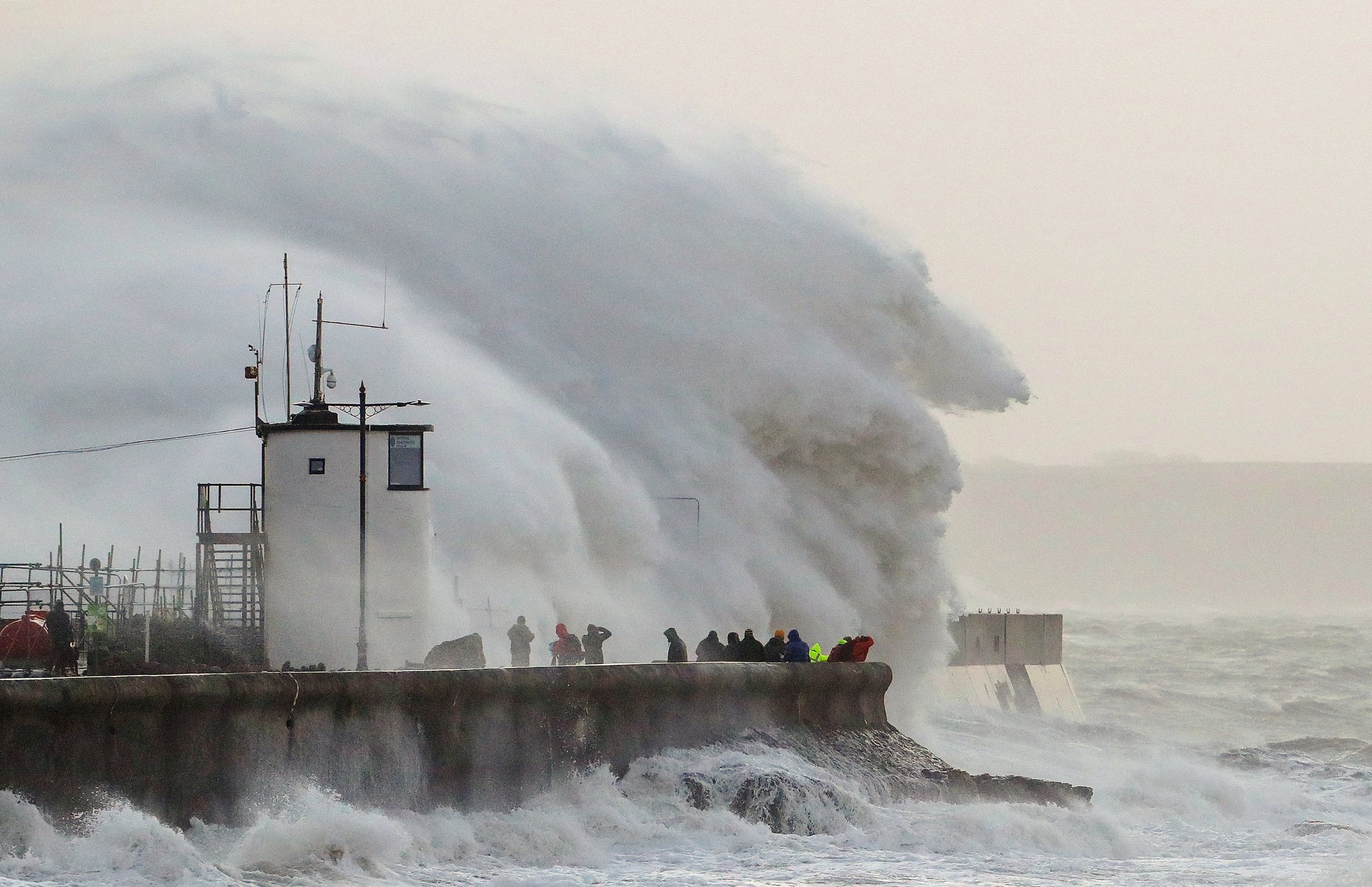 Terrible storm rages in England, tosses ferries, traverses pedestrians, and strands millions
