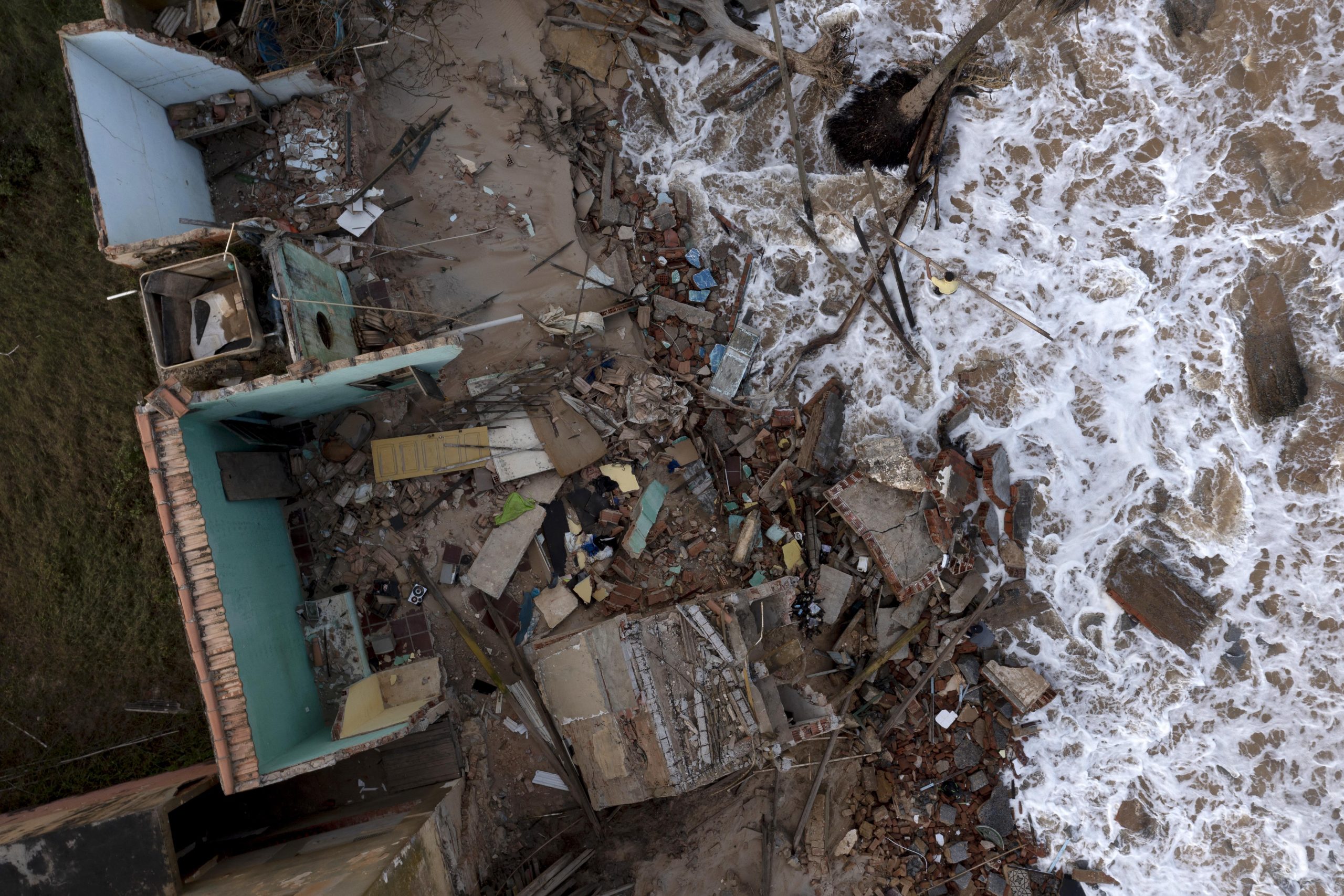 The devastated Brazilian resort town is slowly sinking into the ocean